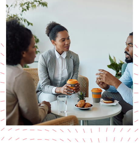 Colleagues having a discussion over coffee
